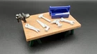 Playmobil Santa's Workshop 9264: Workbench (w/ Vise), Toolbox & Six Tools Used. Price: $12.25.