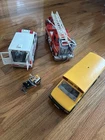 Playmobil Ambulance, Truck, And School Bus With Firefighter Used. Price: $30.00.