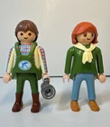 Two Playmobil Zoo Aquarium Dolphin Worker Figures Trainer With Vest Used. Price: $22.00.
