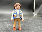 Playmobil (3308) Modern - Women's Brown Hair, Tee Shirt, Vest And Pants Used. Price: $8.00.