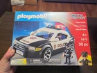 New! Playmobil City Action Police Car Cruiser With Flashing Lights. Price: $30.00.