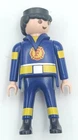 Playmobile Fire Fighter Figure In Blue Yellow Uniform W/a Red Shield Vg Used. Price: $6.99.